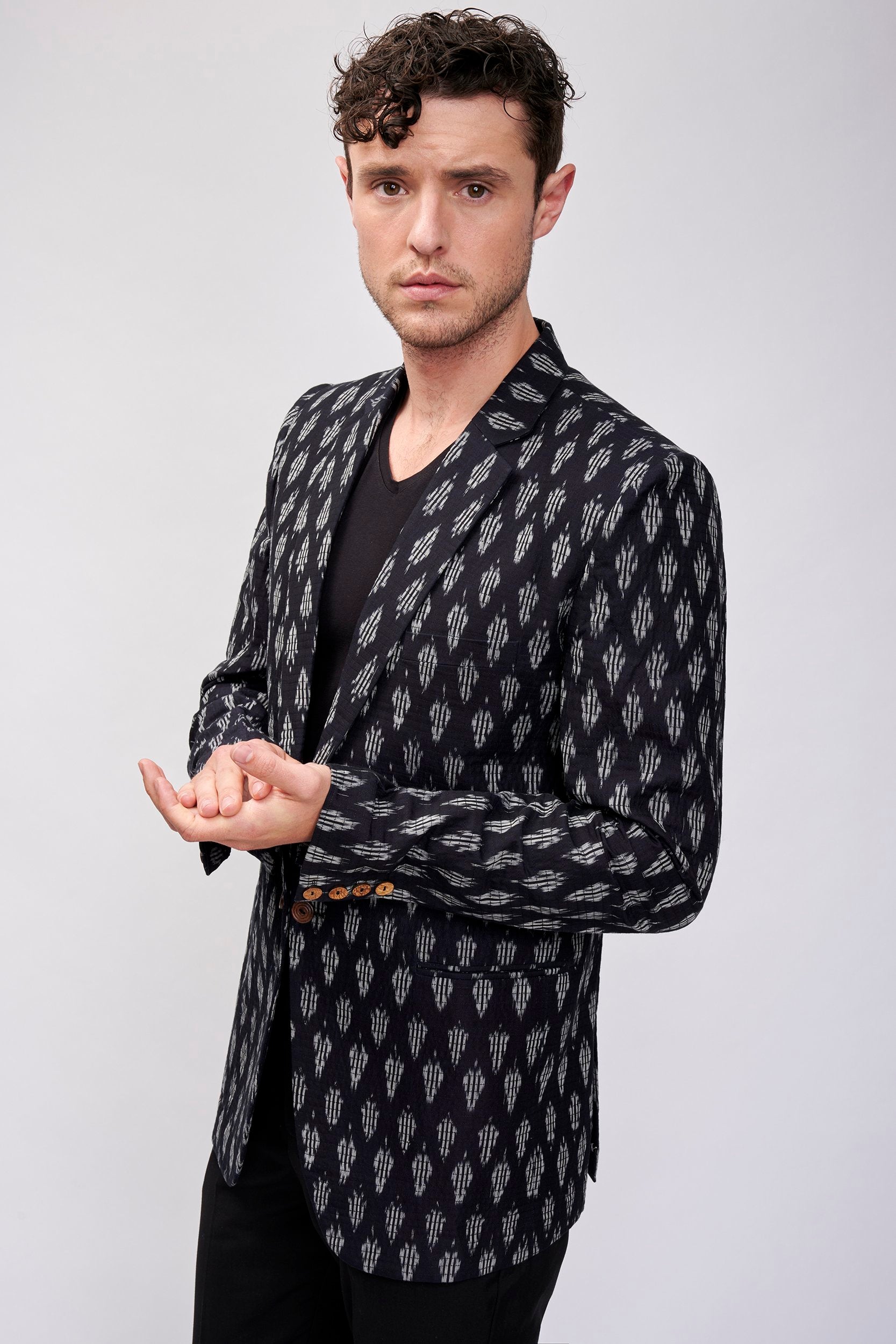 Men's black and white handwoven  blazer with wooden buttons.