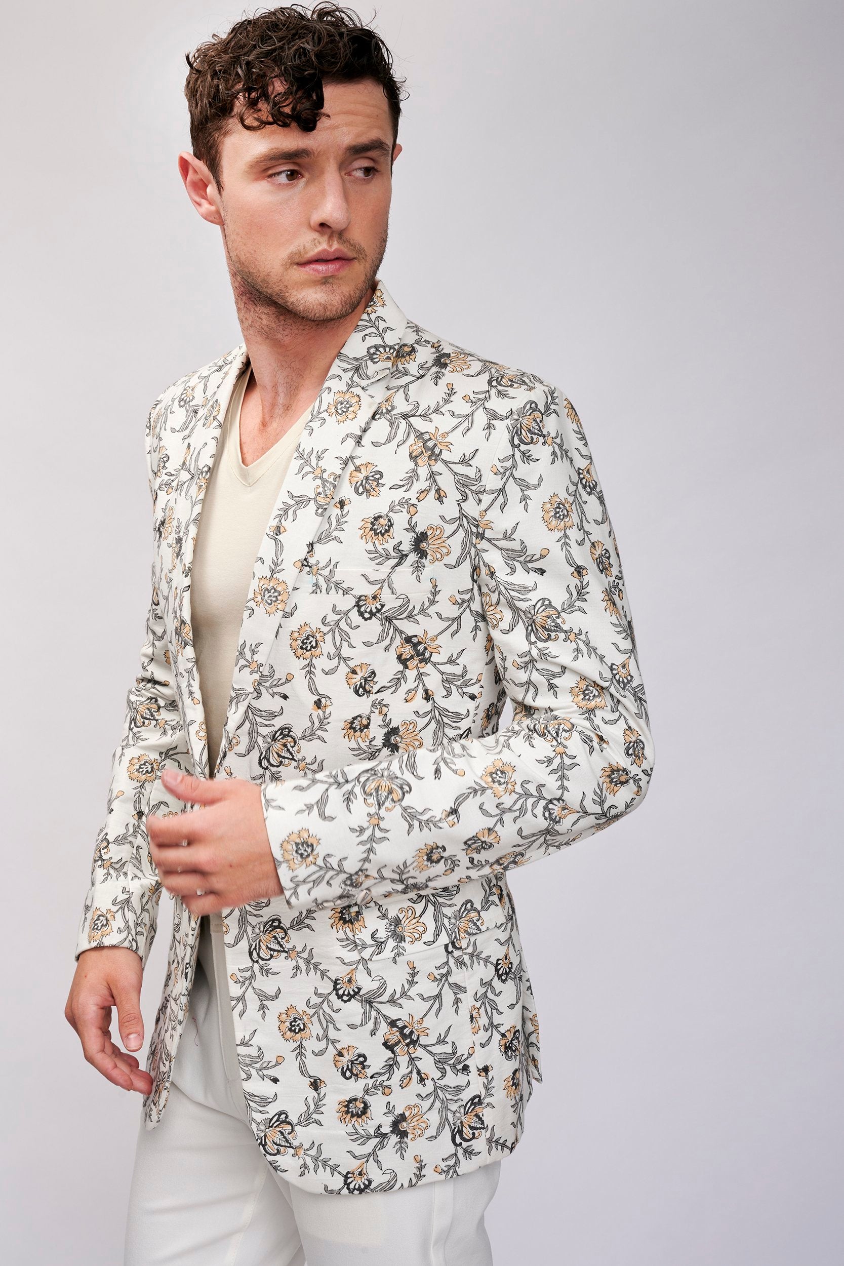 Model wearing a beautiful hand block printed floral jacket made with organic cotton. A perfect blend of style and sustainability in fashion.