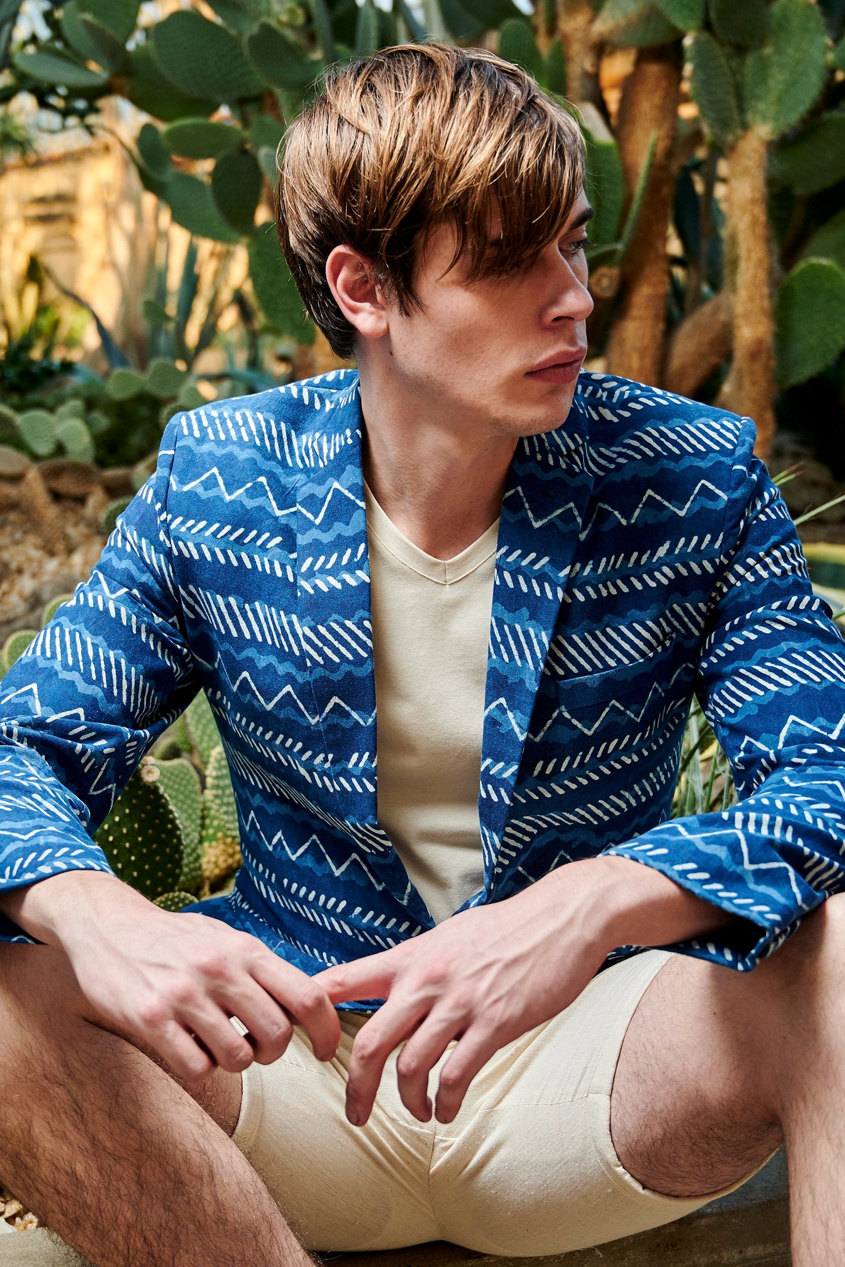 Model wearing a hand block printed Indigo Blazer.Hand-block printed with nature-based dyes from plants and soil.
