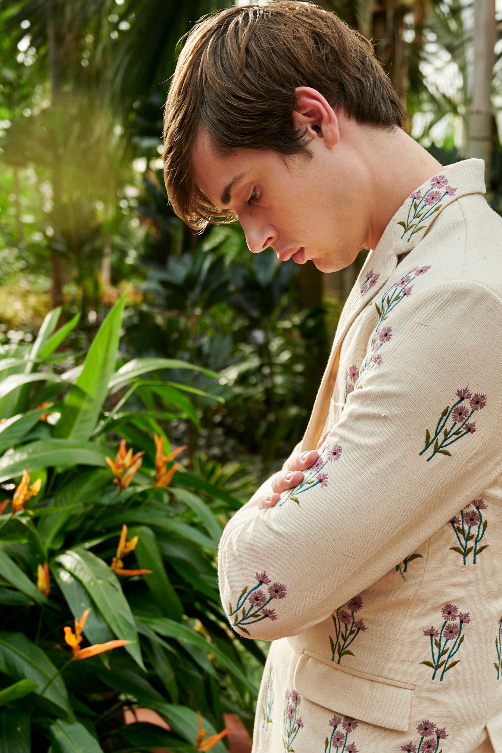 A model wearing an off-white embroidered jacket made with Undyed yarn.