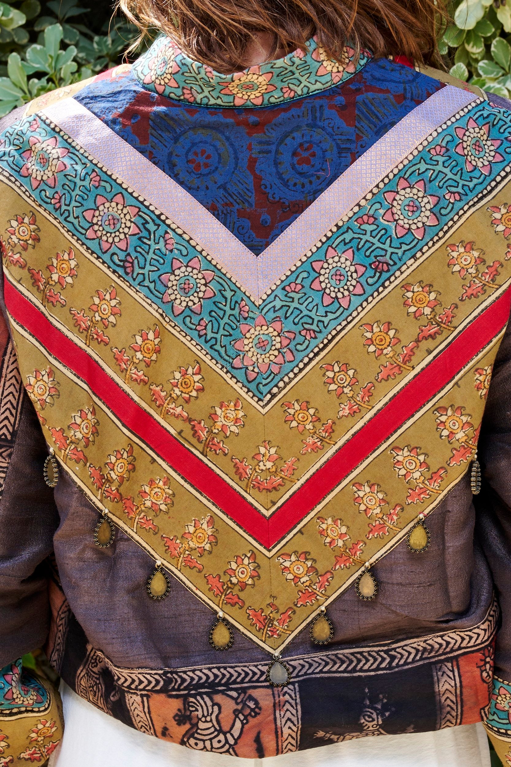 back of a handmade bomber jacket showing floral design elements.